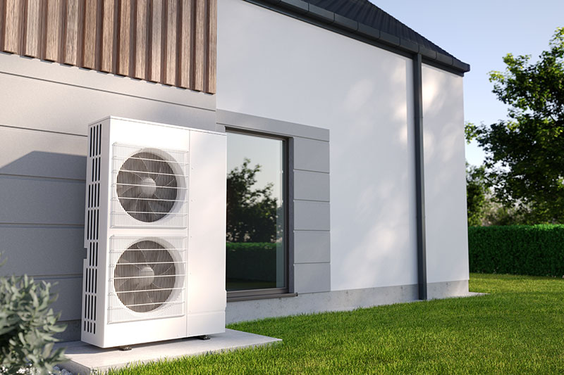 Pompe à chaleur air-air située à l'extérieur d'une habitation